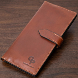 Интересный вертикальный кошелек из натуральной кожи GRANDE PELLE 11660 Коричневый